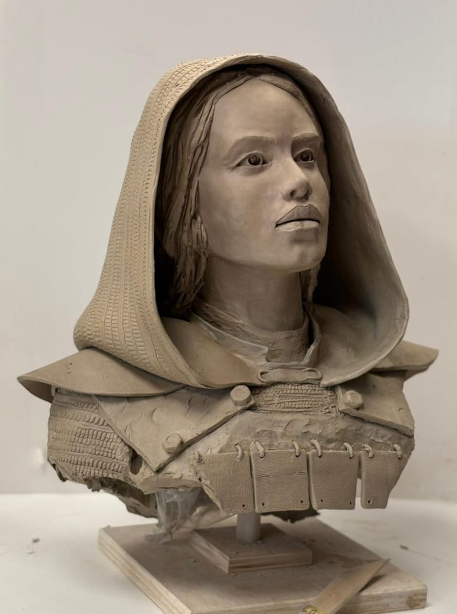 Clay bust — hooded figure with armored shoulders
