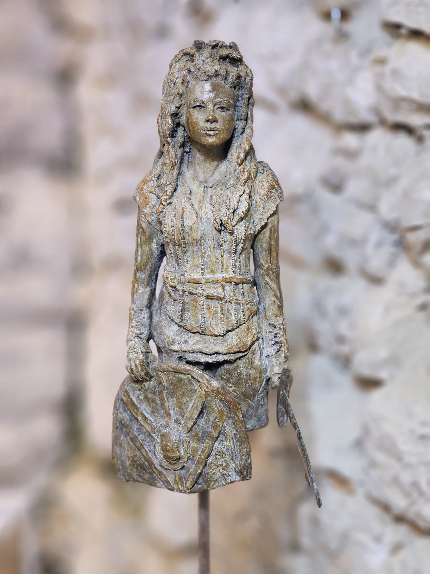 Bronze standing figure — long hair, draped garment