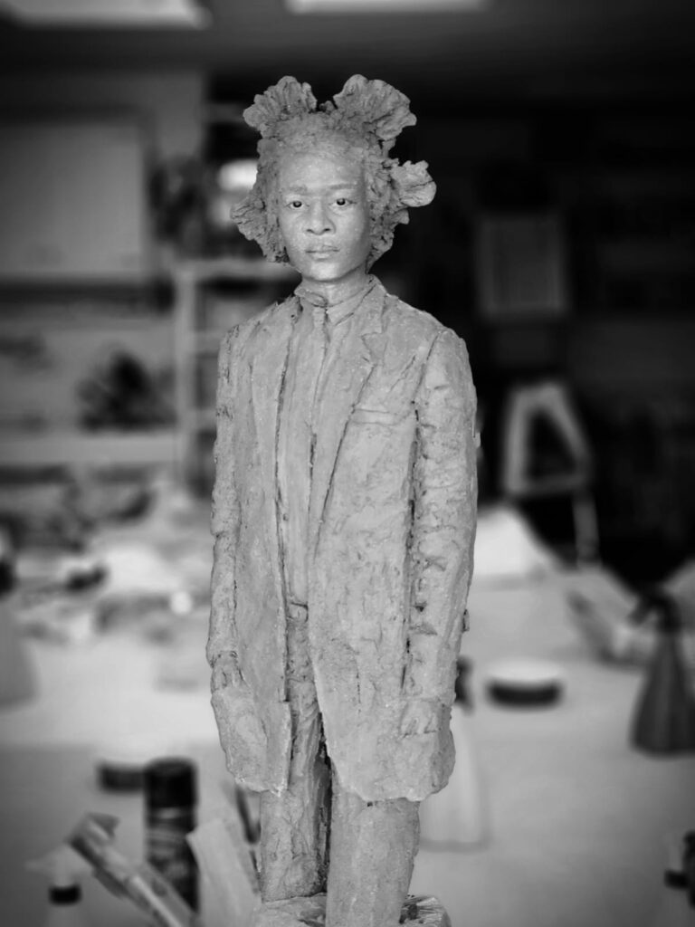 Standing figure — grey patina, steady gaze